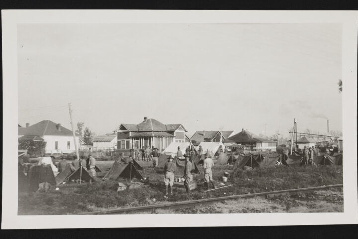 Black-and-white 1919 photograph of U.S. Army soldiers of the 57th Infantry in pup tents during the Elaine race riot in Arkansas.