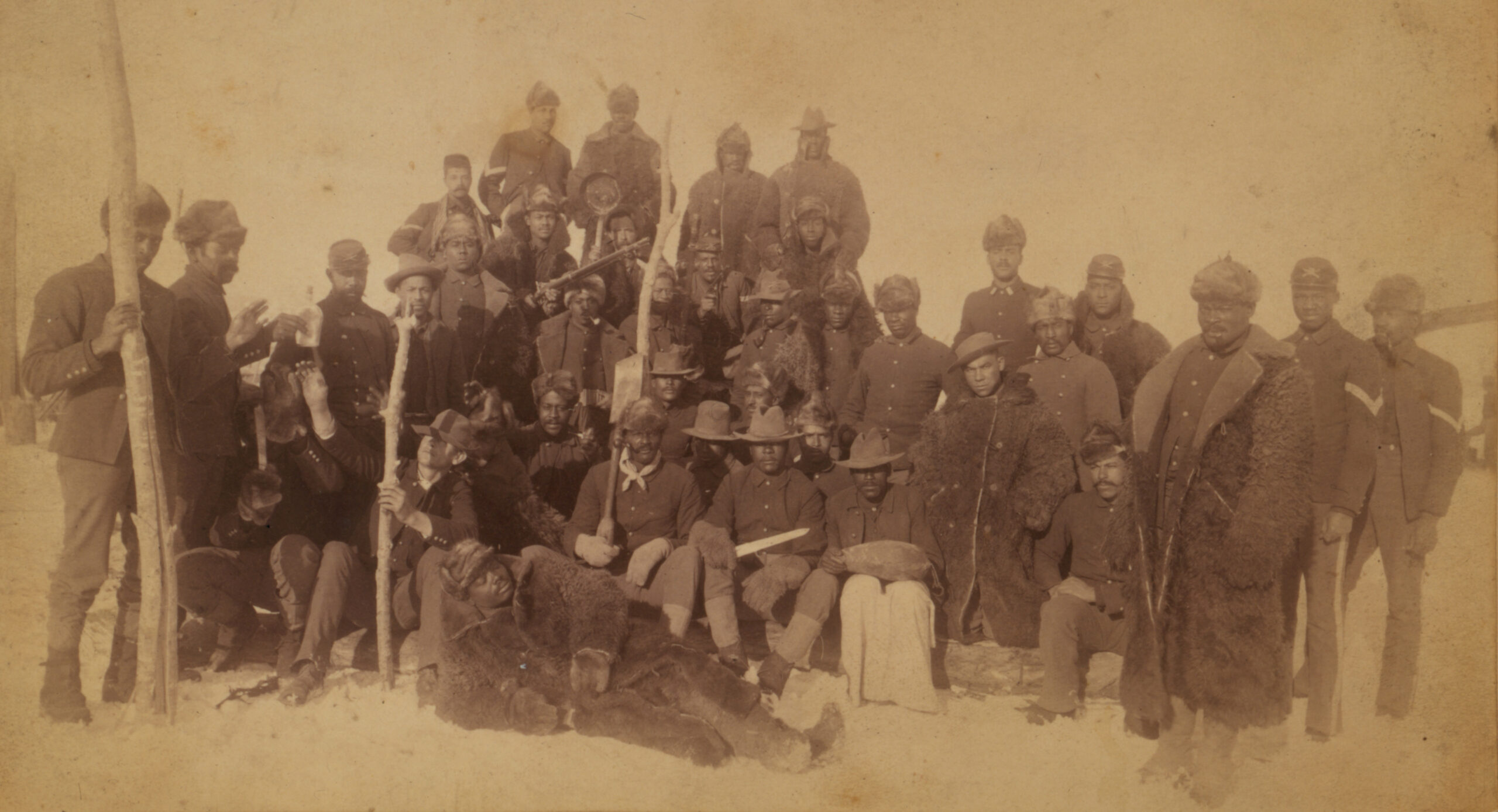 Buffalo Soldiers of the 25th Infantry, some wearing buffalo robes, at Ft. Keogh, Montana, 1890 (Library of Congress)