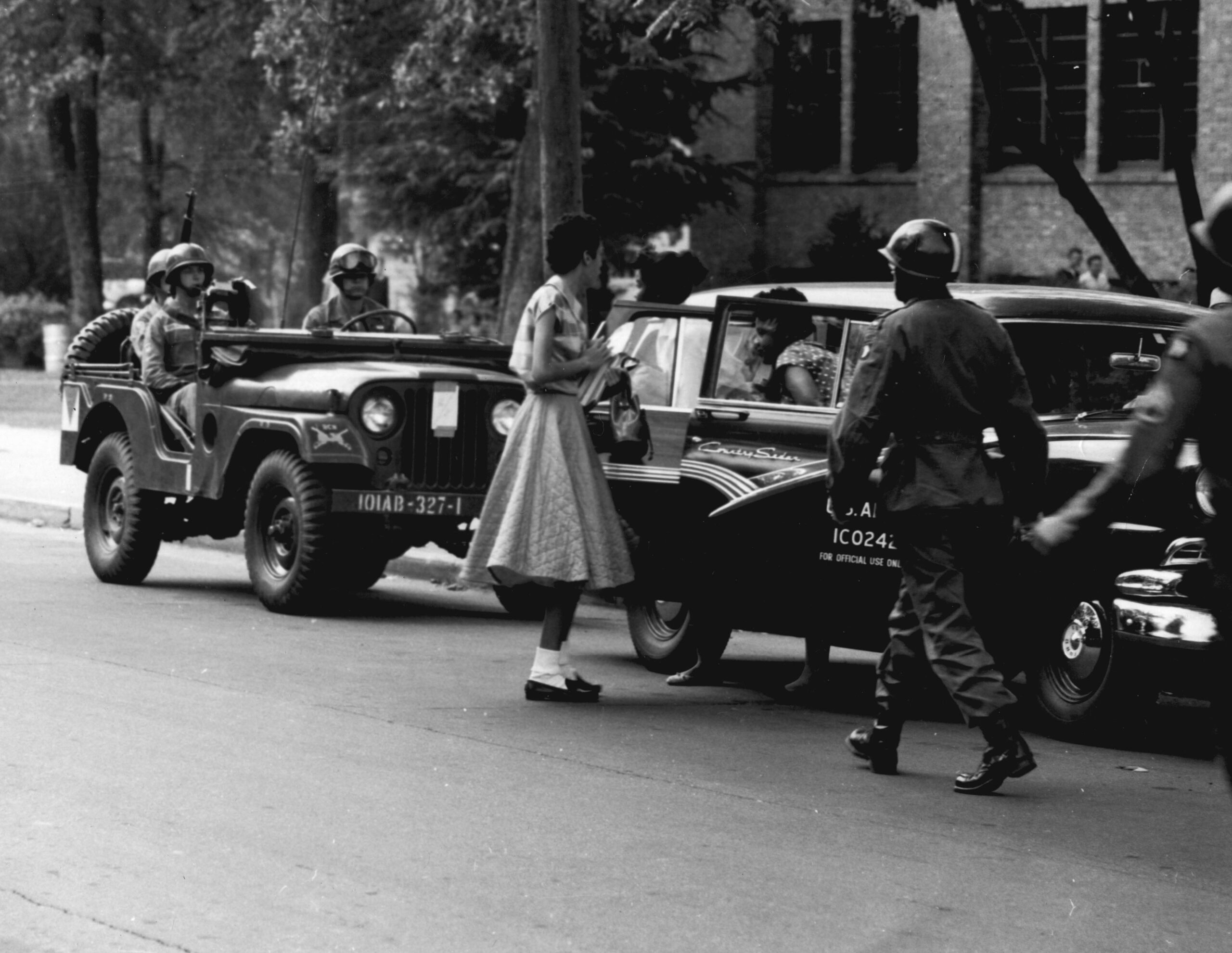 U.S. Army paratroopers of the 101st Airborne Division escorting members of the Little Rock Nine to Central High School in Little Rock, Arkansas, September 1957.