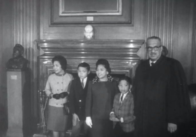 Thurgood Marshall in judicial robes with his family at the Supreme Court, October 1967.