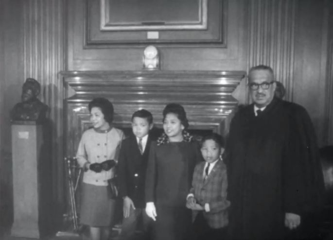 Thurgood Marshall in judicial robes with his family at the Supreme Court, October 1967.